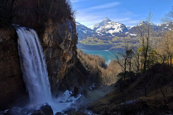 From Zurich: Breathtaking waterfall and lakes private tour - Linthal in UNESCO Sardona: walking behind the falling water