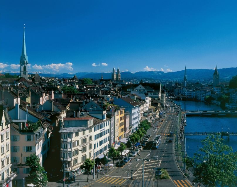 Zurich: City Bus Tour with Audio Guide and Lake Cruise - Lake Zurich at Bürkliplatz: the calm scenic half of the day