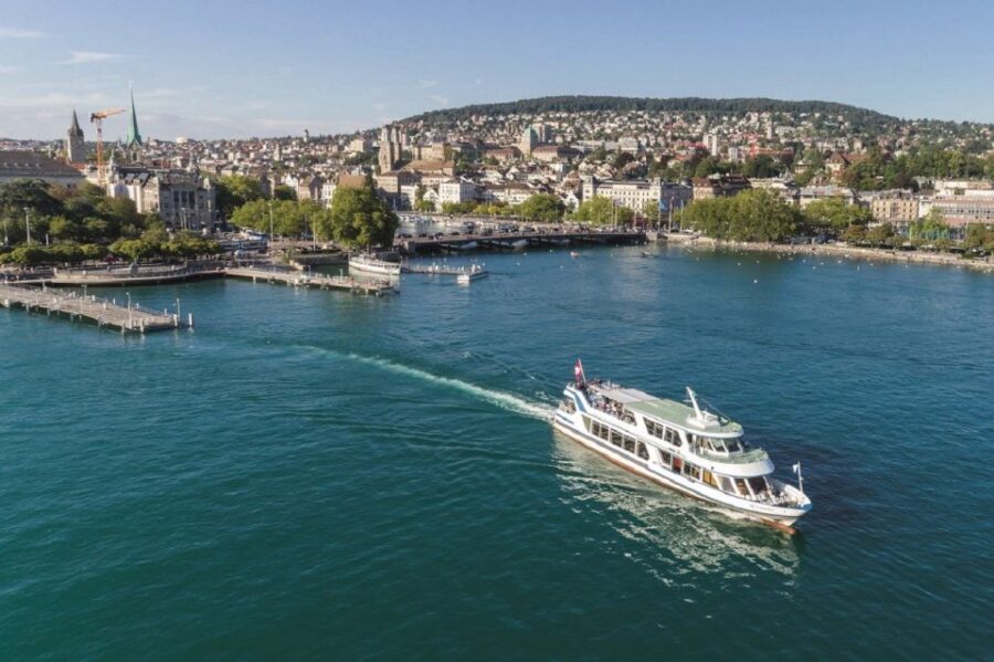 Zurich: City Sightseeing Tour with Lake Cruise - Old Town on foot: guild houses, churches, squares, and guided anecdotes