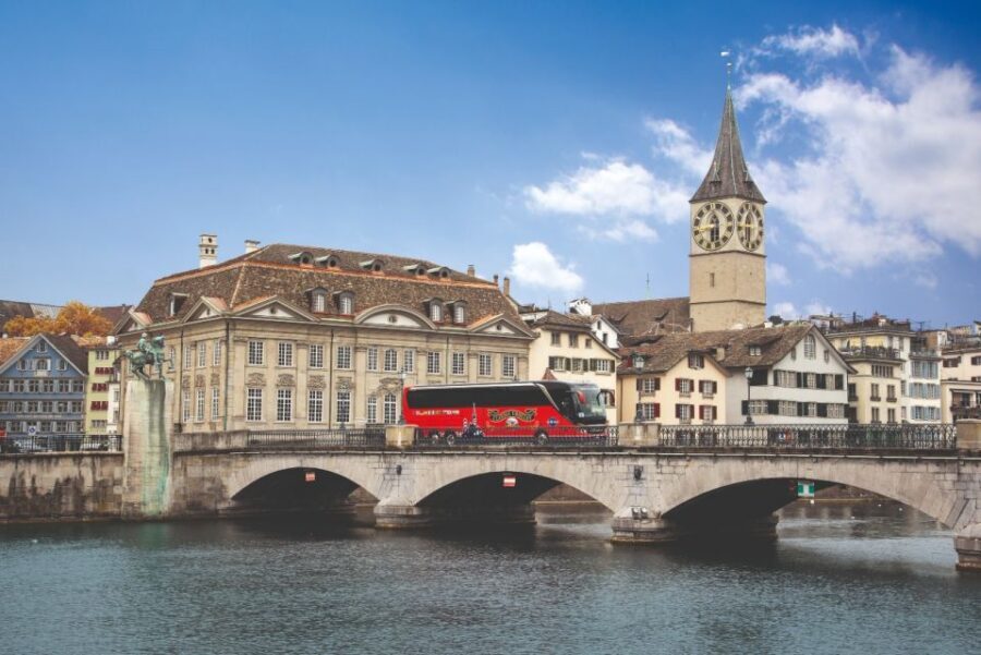 Zurich: City Top Attractions Tour by Bus with Audio Guide - Old town churches and guild houses on the route